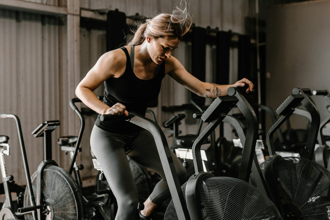 woman using exercise bike