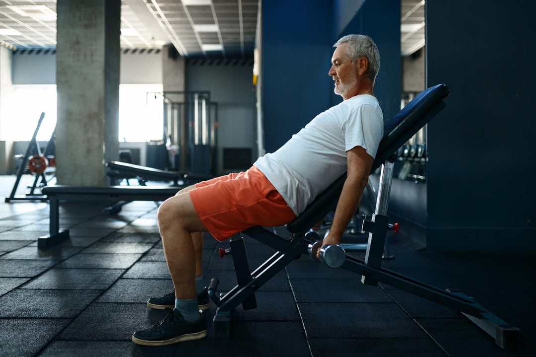senior man using weight bench