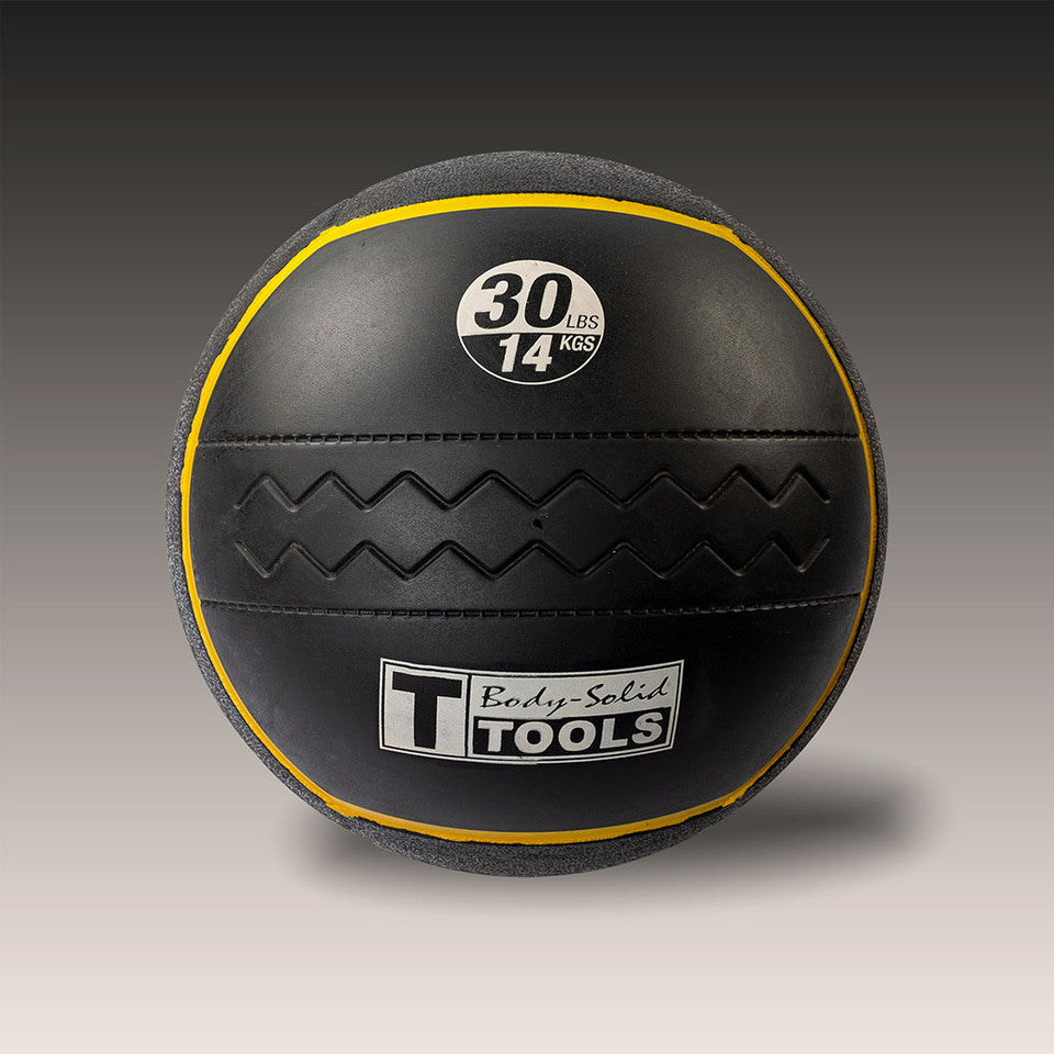 Body-Solid Tools 30 lb heavy rubber medicine ball with yellow weight indicator.