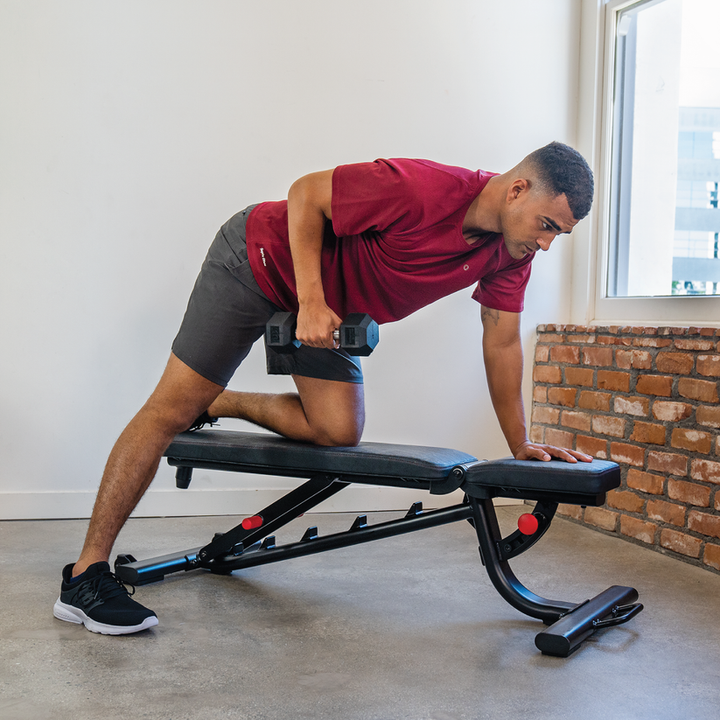 Adjustable weight bench flat position for single arm dumbbell row targeting back muscles in home workout
