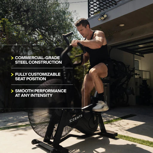Athlete using the Centr x HYROX Perform Series air bike during a high-intensity workout.