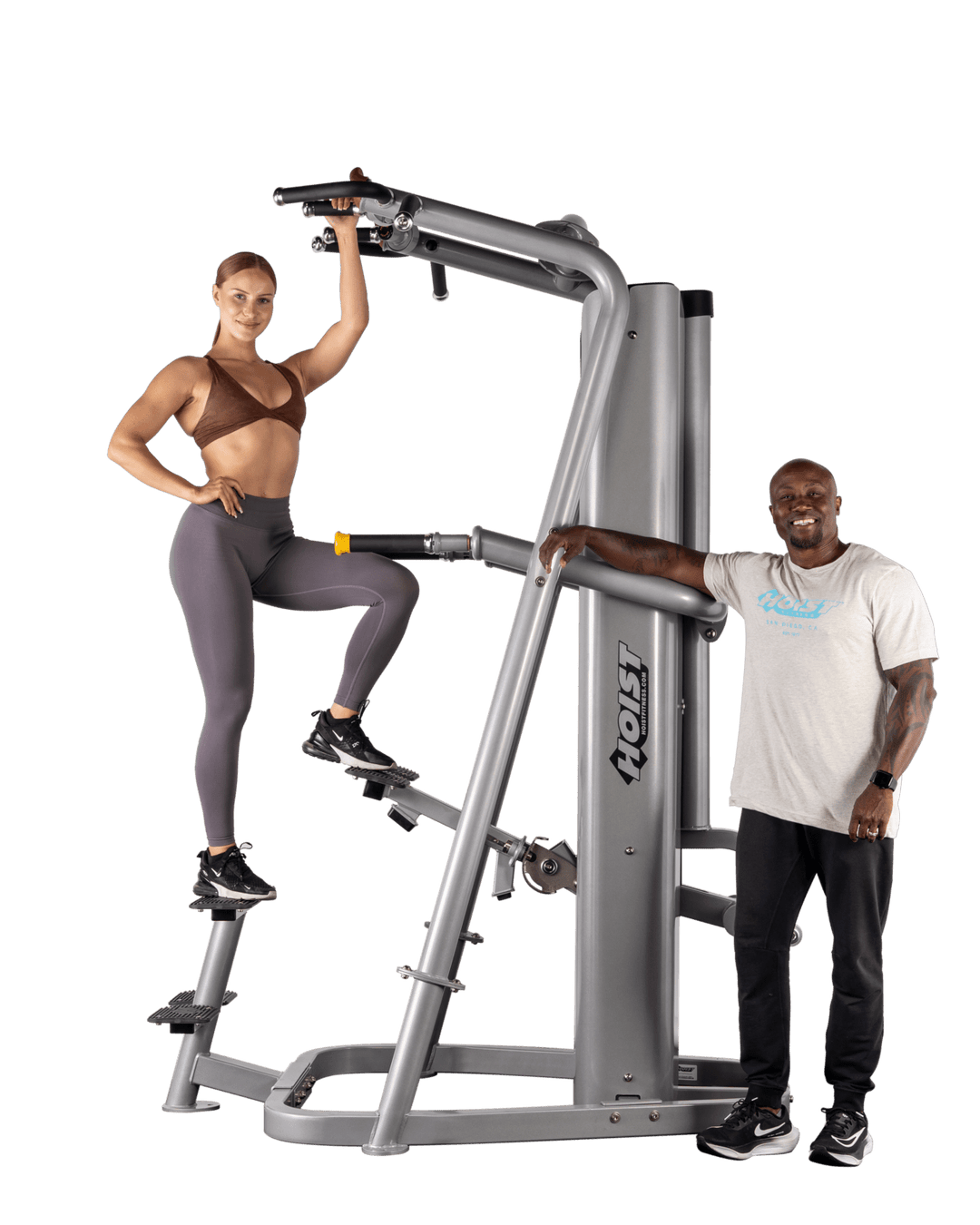 user stepping onto assisted dip machine platform preparing to begin exercise