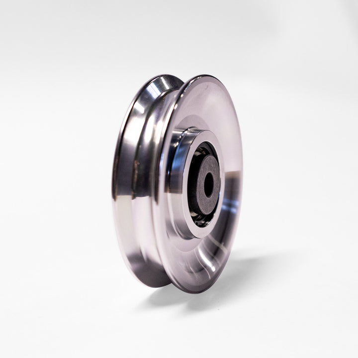 Side profile of the Body-Solid AP3 aluminum pulley showing its machined aluminum design.