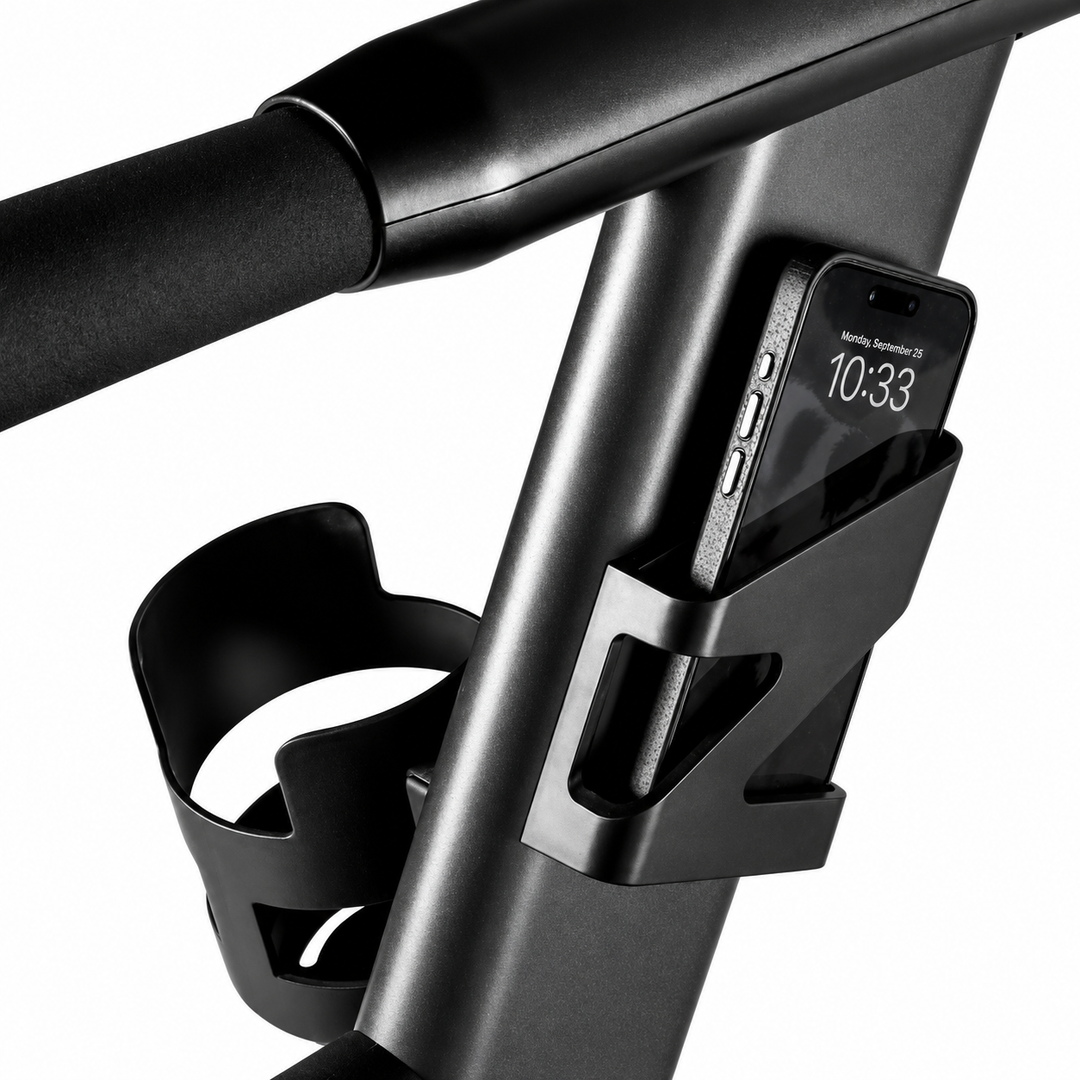Integrated phone and tablet holder with cup holder on the CENTR curved treadmill for convenient workout access.