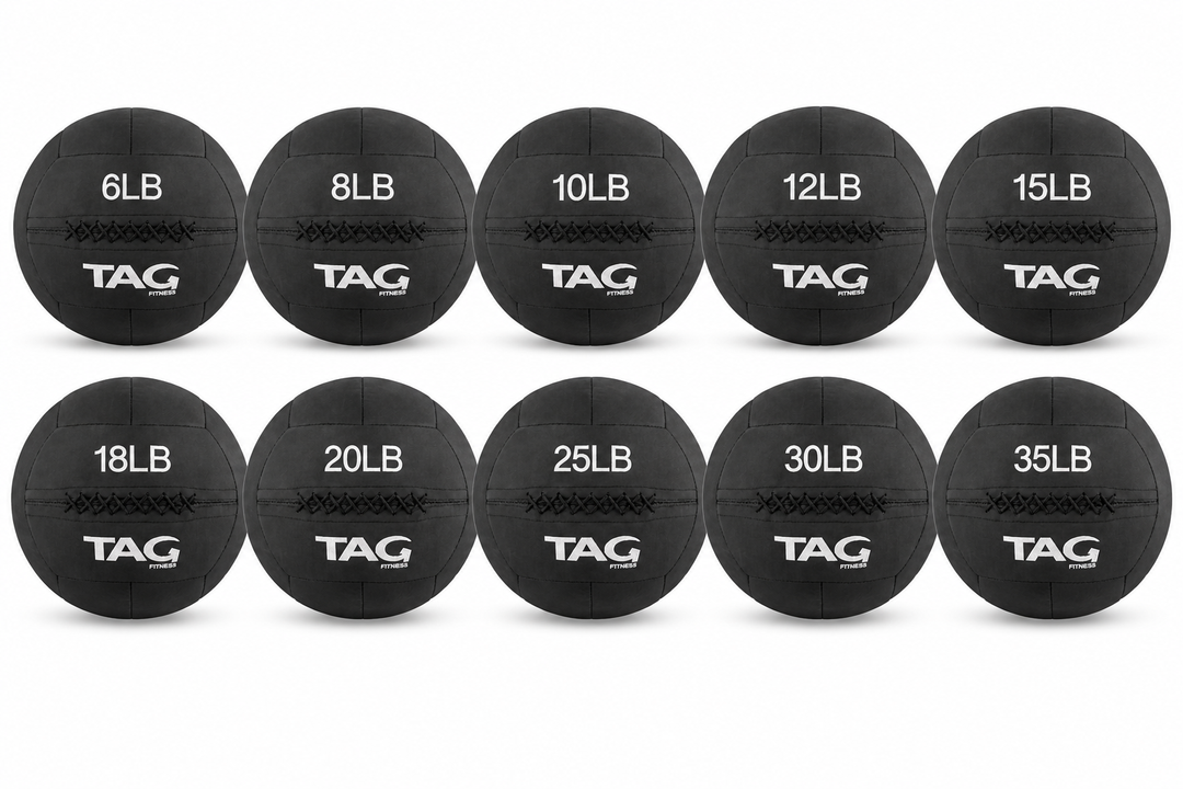 Set of black BulletProof medicine balls in multiple weights arranged in two rows