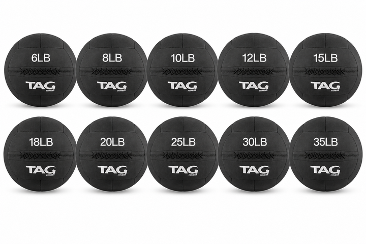 Set of black BulletProof medicine balls in multiple weights arranged in two rows