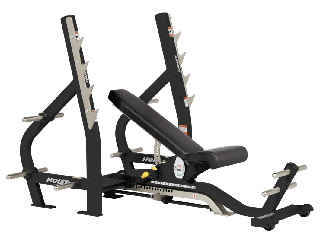 black HOIST 3-way Olympic bench with adjustable incline decline back pad and barbell rack supports for commercial gym use