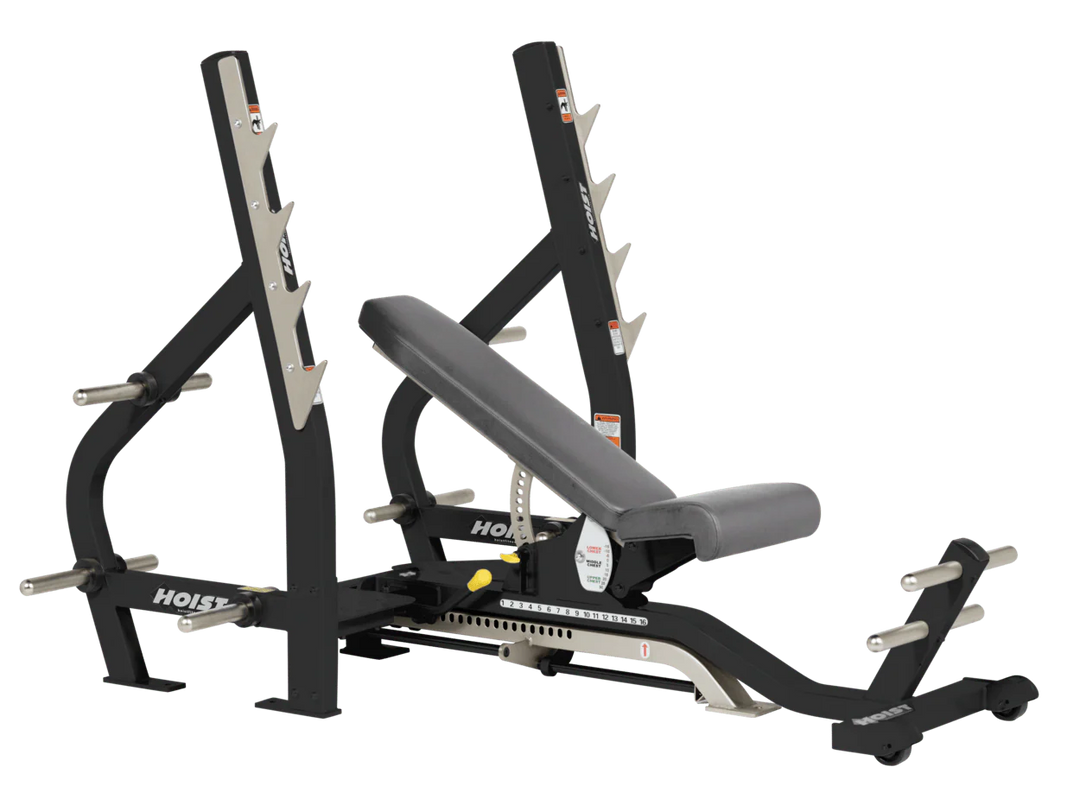 Slate grey HOIST 3-way Olympic bench with adjustable incline decline back pad and barbell rack supports for commercial gym use