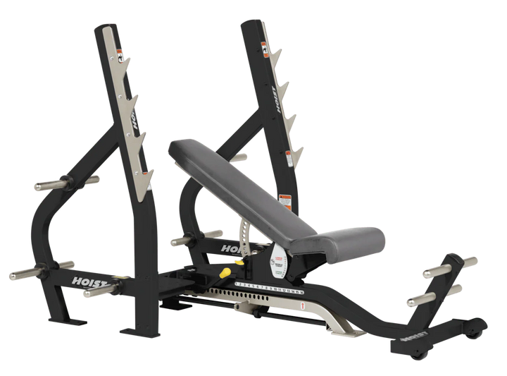 Slate grey HOIST 3-way Olympic bench with adjustable incline decline back pad and barbell rack supports for commercial gym use