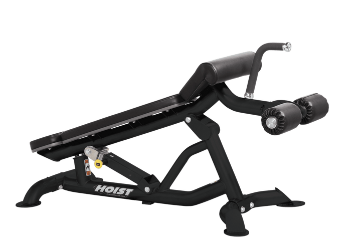 Hoist super flat decline bench with leg hold-down rollers and black padded seat for strength training exercises