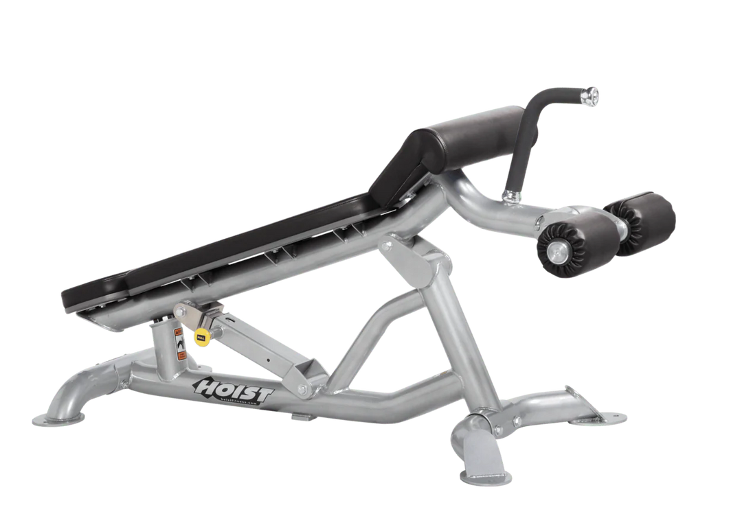 Hoist super flat decline bench with leg hold-down rollers and platinum black padded seat for strength training exercises