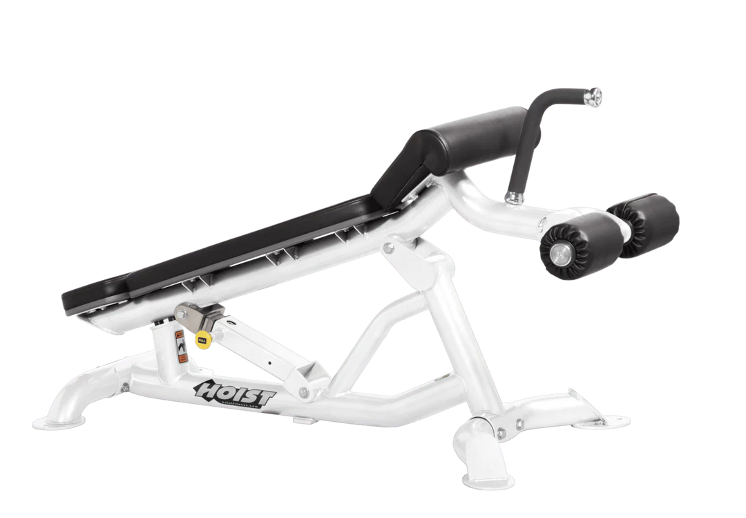 Hoist super flat decline bench with leg hold-down rollers and white black padded seat for strength training exercises