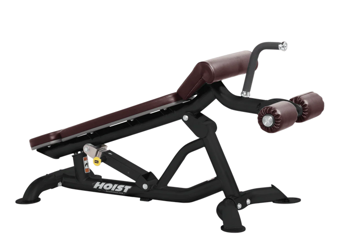 Hoist super flat decline bench with leg hold-down rollers and burgundy padded seat for strength training exercises