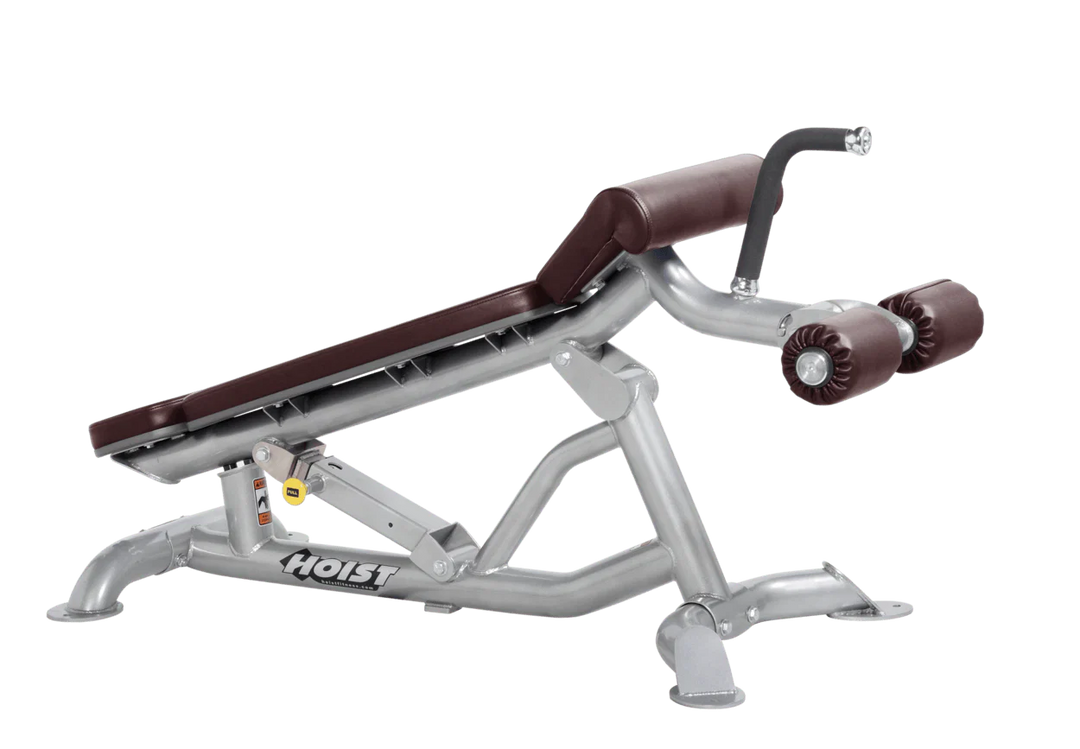 Hoist super flat decline bench with leg hold-down rollers and platinum burgundy padded seat for strength training exercises