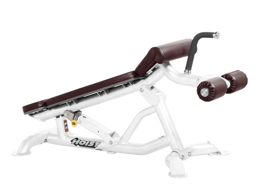 Hoist super flat decline bench with leg hold-down rollers and white burgundy padded seat for strength training exercises