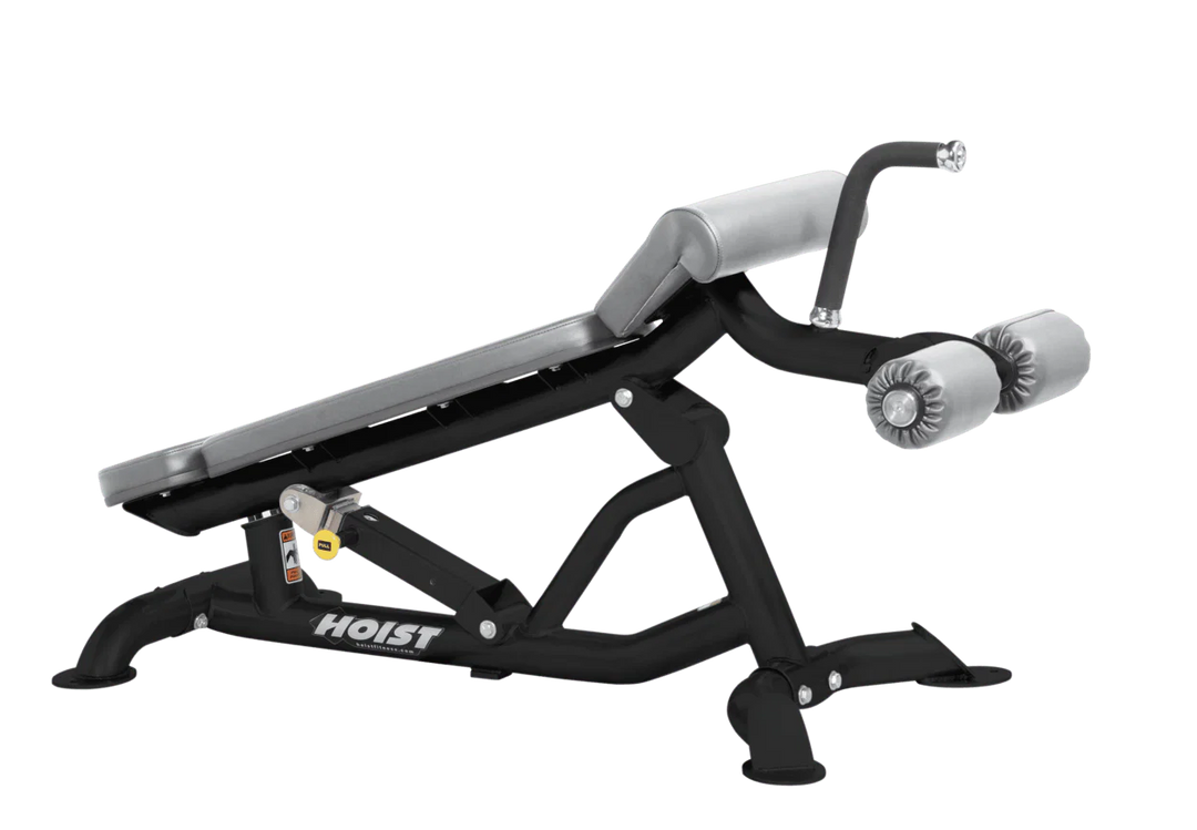 Hoist super flat decline bench with leg hold-down rollers and dove grey padded seat for strength training exercises