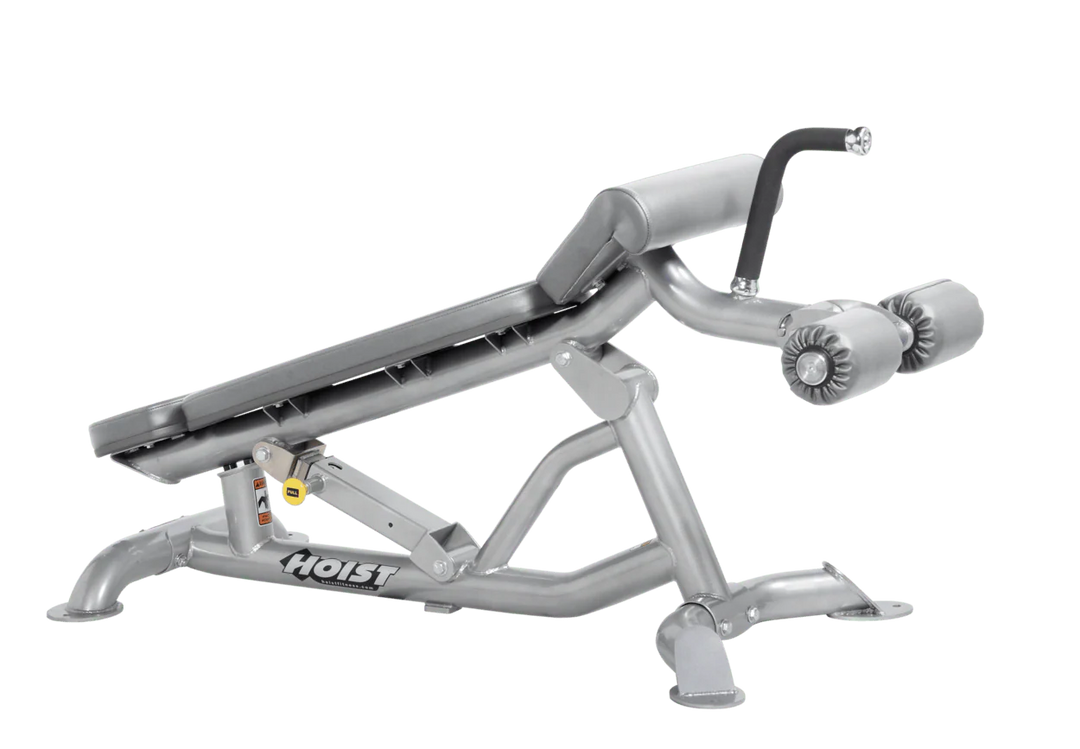 Hoist super flat decline bench with leg hold-down rollers and platinum dove grey padded seat for strength training exercises
