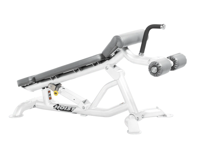 Hoist super flat decline bench with leg hold-down rollers and white dove grey padded seat for strength training exercises