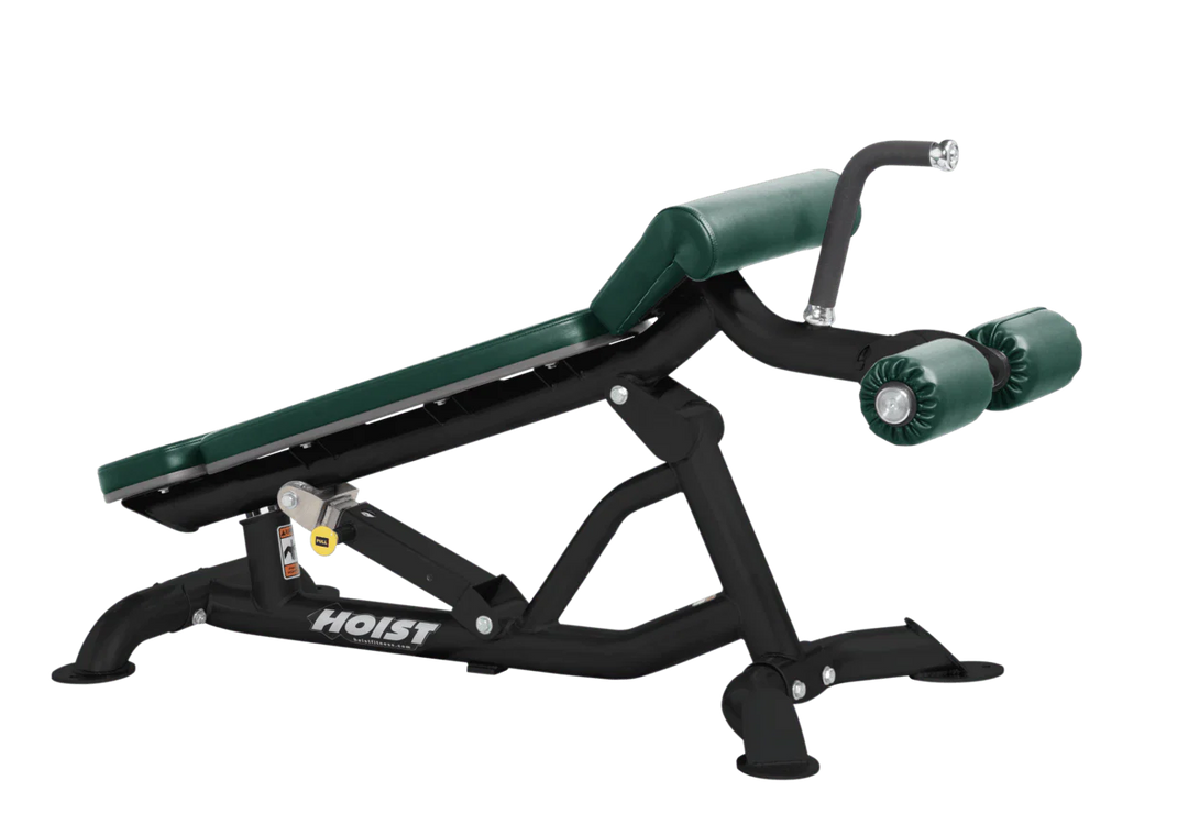 Hoist super flat decline bench with leg hold-down rollers and hunter green padded seat for strength training exercises