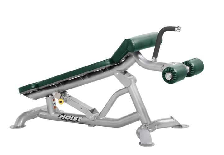 Hoist super flat decline bench with leg hold-down rollers and platinum hunter green padded seat for strength training exercises