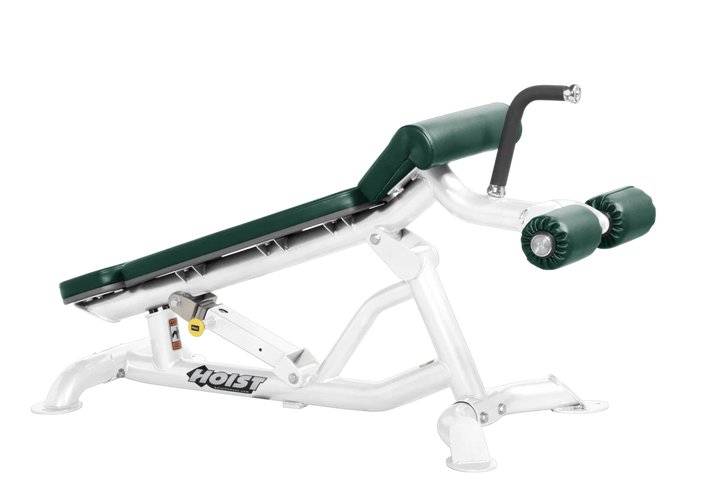 Hoist super flat decline bench with leg hold-down rollers and white hunter green padded seat for strength training exercises