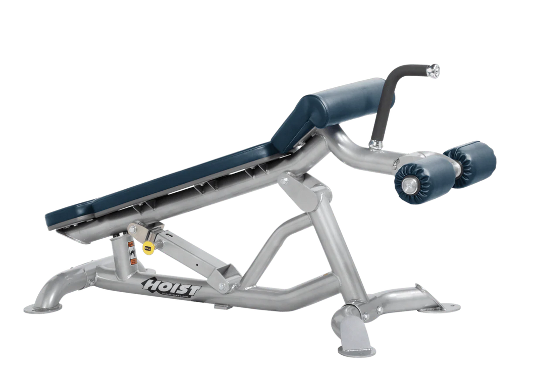 Hoist super flat decline bench with leg hold-down rollers and platinum navy blue padded seat for strength training exercises