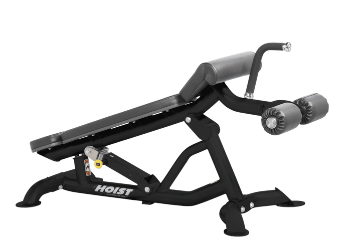 Hoist super flat decline bench with leg hold-down rollers and slate grey padded seat for strength training exercises