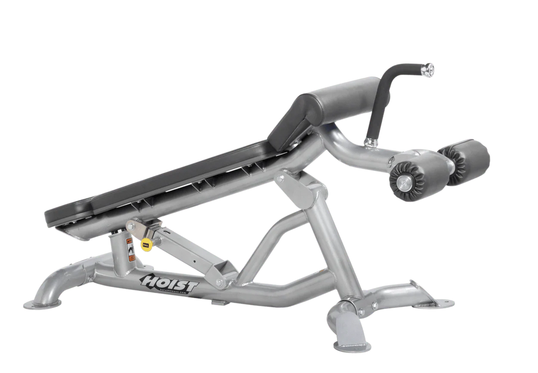 Hoist super flat decline bench with leg hold-down rollers and platinum slate grey padded seat for strength training exercises