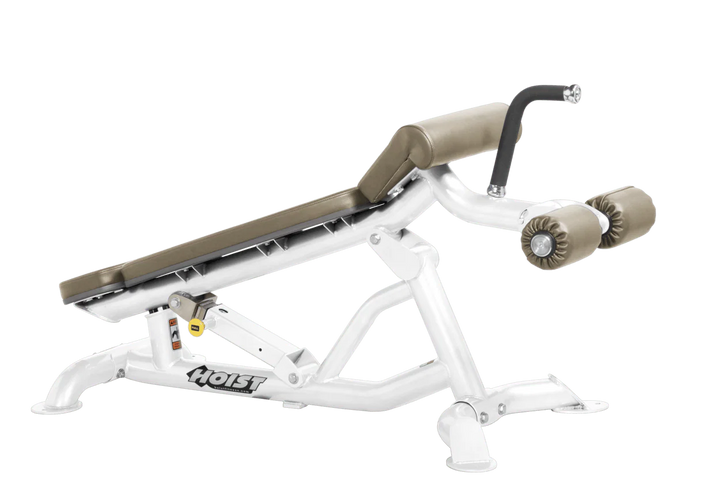 Hoist super flat decline bench with leg hold-down rollers and white suede padded seat for strength training exercises