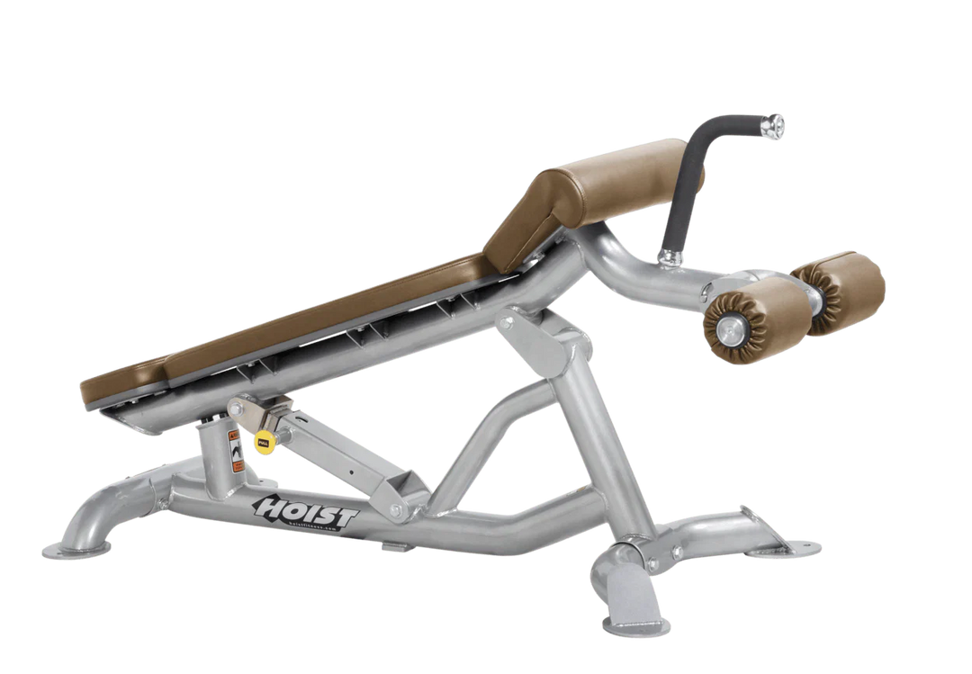 Hoist super flat decline bench with leg hold-down rollers and platinum wheat padded seat for strength training exercises