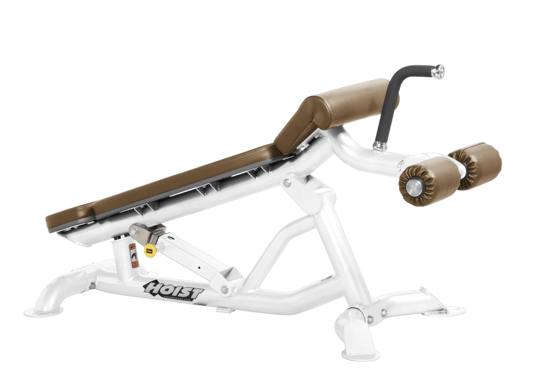Hoist super flat decline bench with leg hold-down rollers and white wheat padded seat for strength training exercises