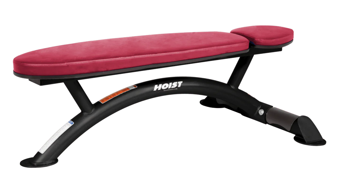 Hoist commercial flat bench with american beauty padding and curved steel frame for weightlifting and strength training