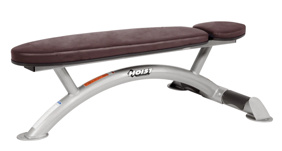 Hoist commercial flat bench with platinum burgundy padding and curved steel frame for weightlifting and strength training