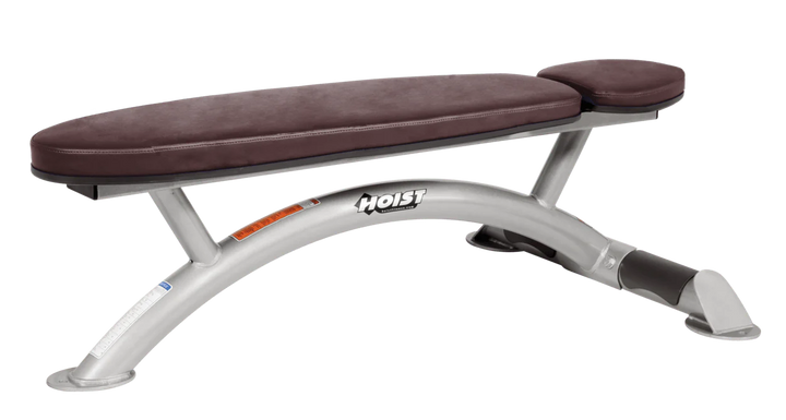 Hoist commercial flat bench with platinum burgundy padding and curved steel frame for weightlifting and strength training
