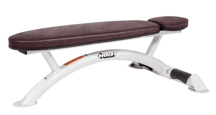 Hoist commercial flat bench with white burgundy padding and curved steel frame for weightlifting and strength training