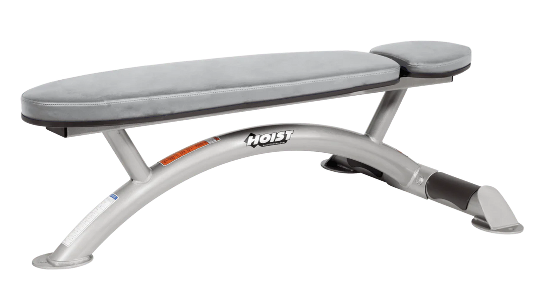 Hoist commercial flat bench with platinum dove grey padding and curved steel frame for weightlifting and strength training