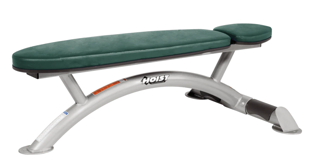 Hoist commercial flat bench with platinum hunter green padding and curved steel frame for weightlifting and strength training