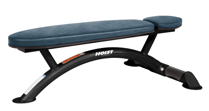 Hoist commercial flat bench with navy blue padding and curved steel frame for weightlifting and strength training