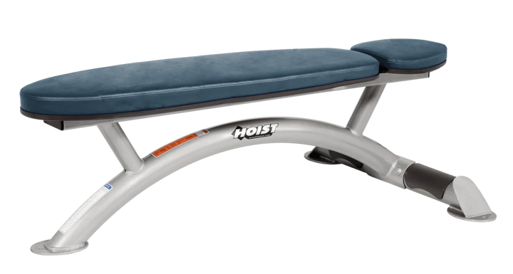 Hoist commercial flat bench with platinum navy blue padding and curved steel frame for weightlifting and strength training