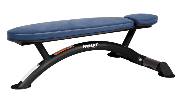 Hoist commercial flat bench with royal blue padding and curved steel frame for weightlifting and strength training