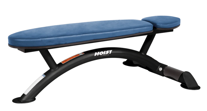 Hoist commercial flat bench with sky blue padding and curved steel frame for weightlifting and strength training