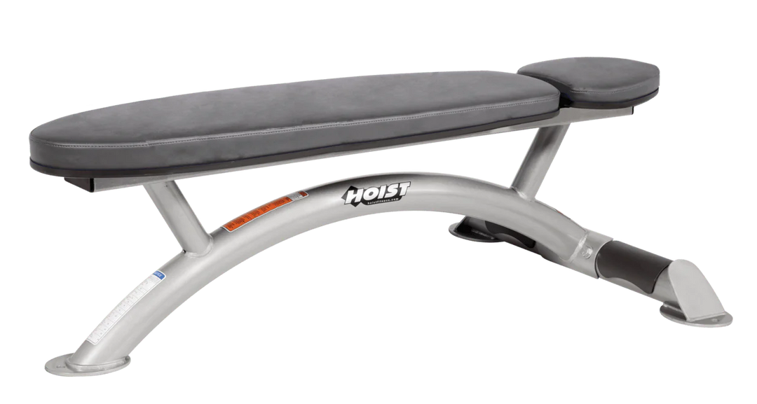 Hoist commercial flat bench with platinum slate grey padding and curved steel frame for weightlifting and strength training