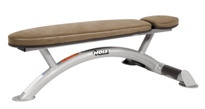 Hoist commercial flat bench with platinum wheat padding and curved steel frame for weightlifting and strength training