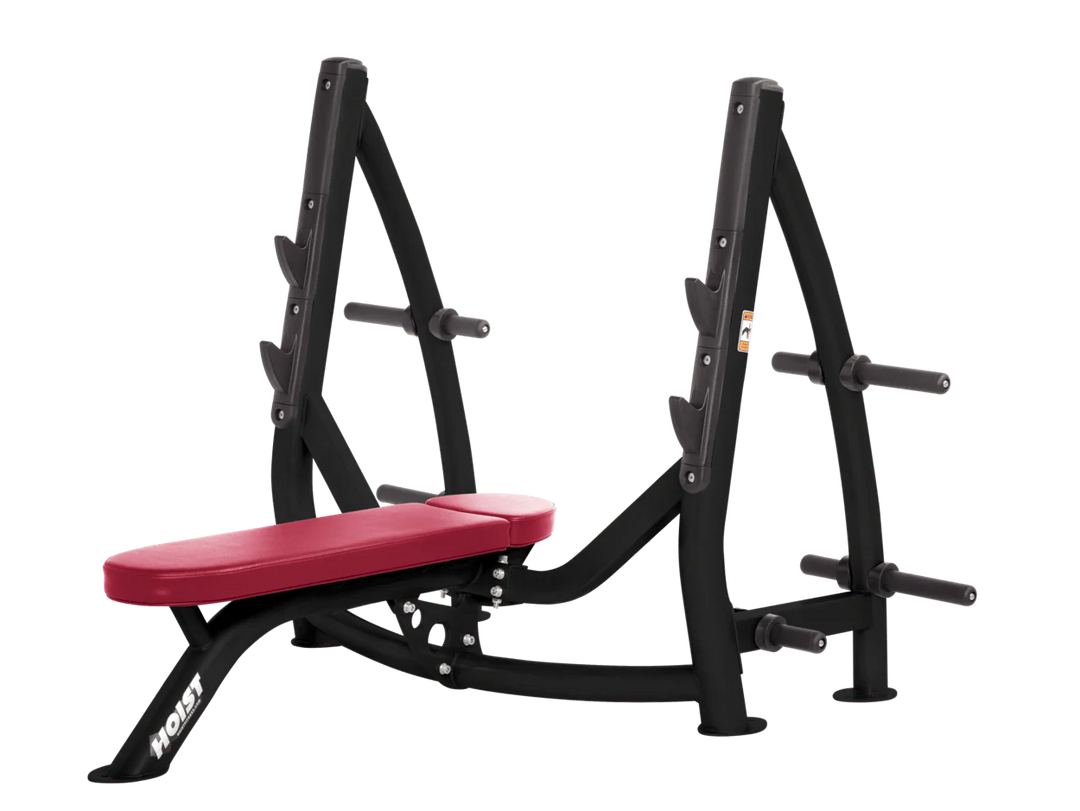 Hoist american beauty commercial Olympic flat bench with built-in weight plate storage and barbell rack for strength training