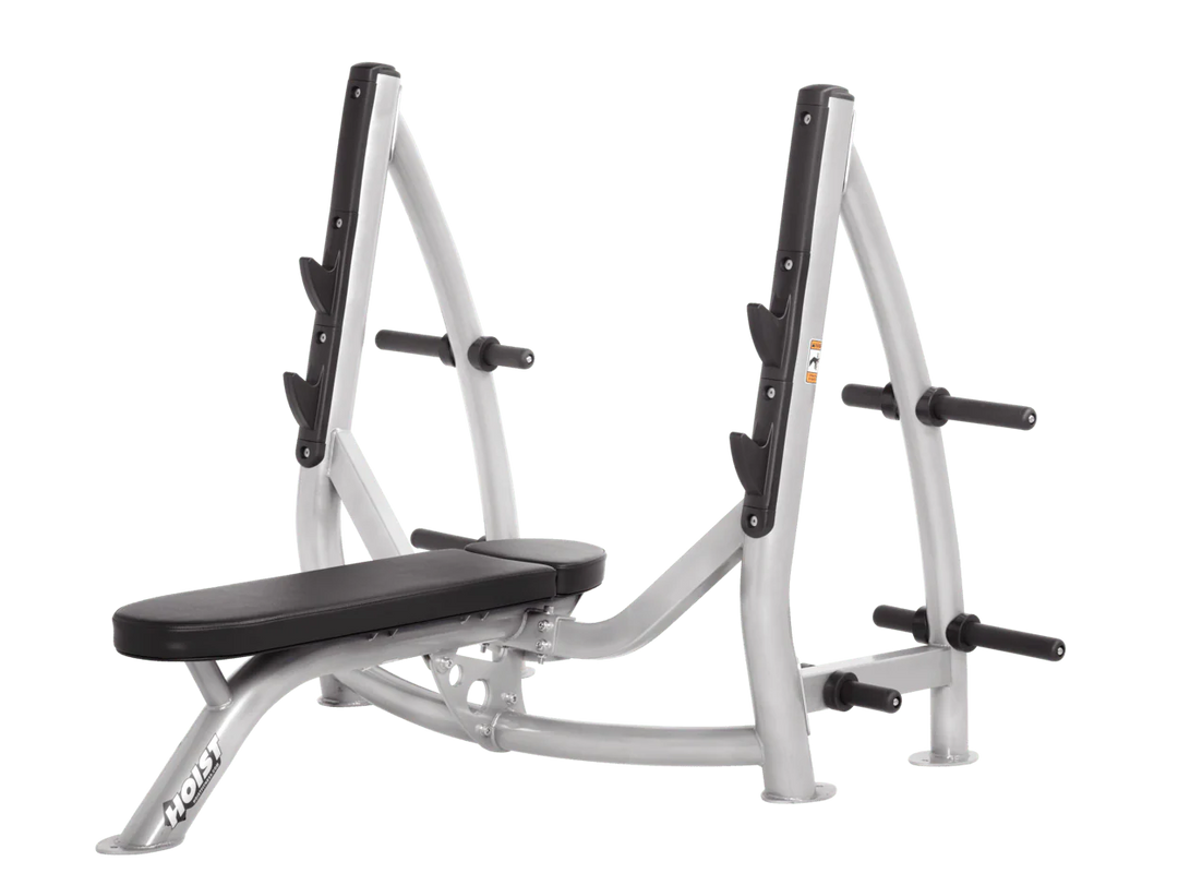 Hoist platinum black commercial Olympic flat bench with built-in weight plate storage and barbell rack for strength training