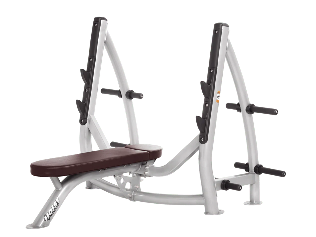 Hoist platinum burgundy commercial Olympic flat bench with built-in weight plate storage and barbell rack for strength training