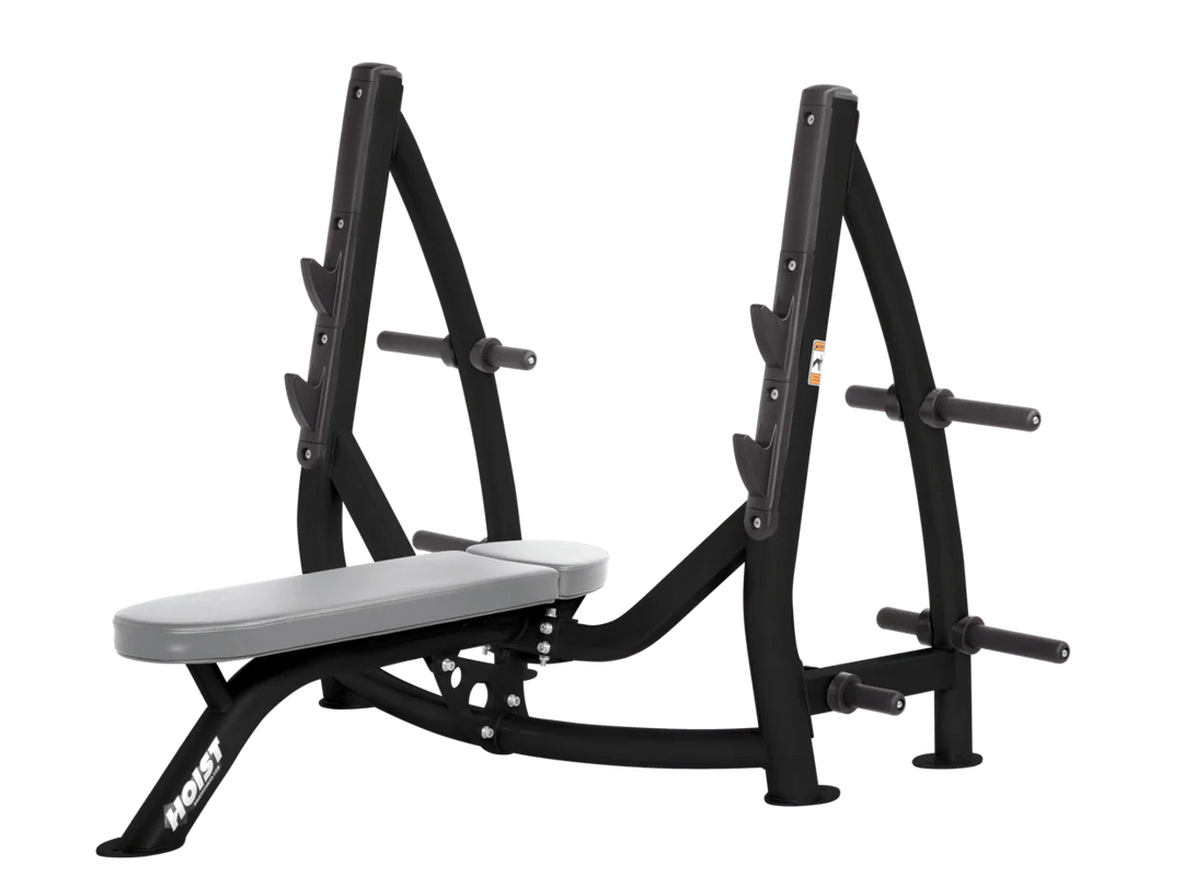 Hoist dove grey commercial Olympic flat bench with built-in weight plate storage and barbell rack for strength training