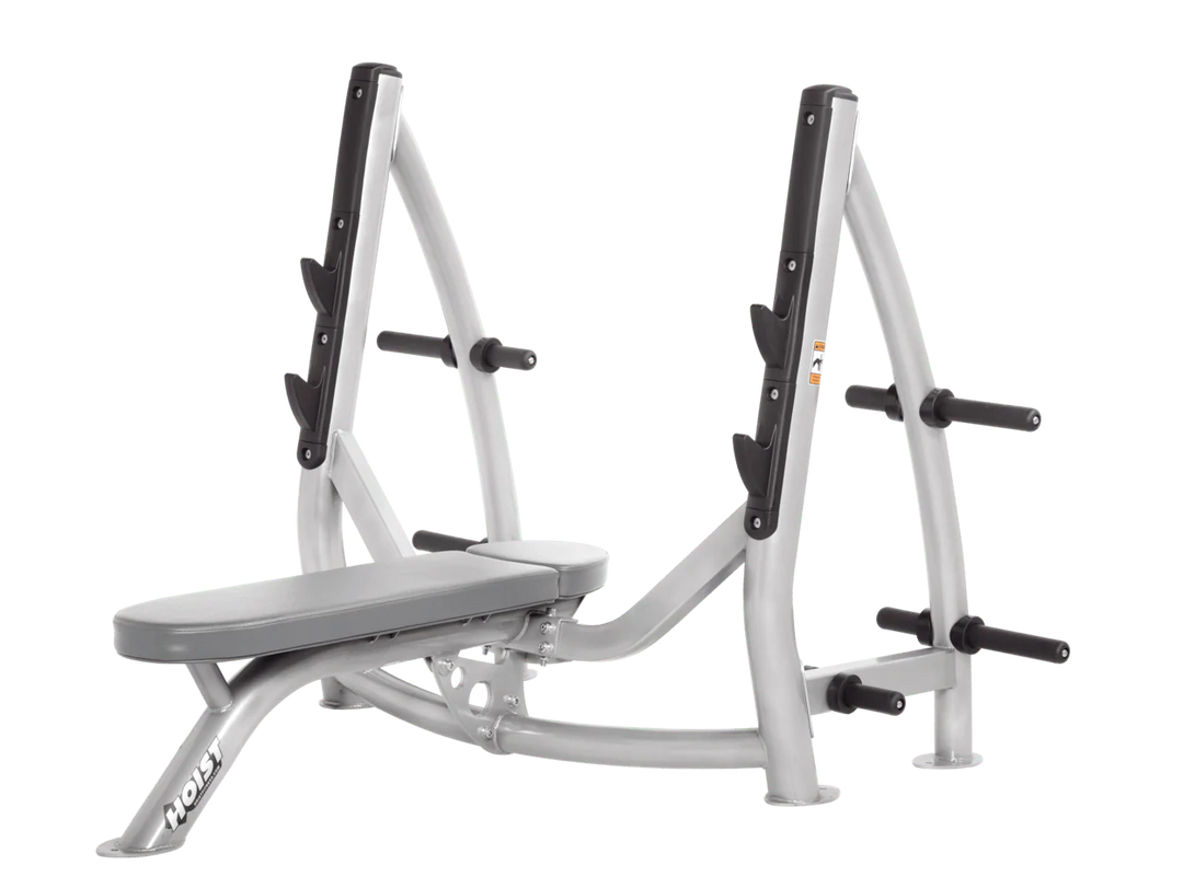 Hoist platinum dove grey commercial Olympic flat bench with built-in weight plate storage and barbell rack for strength training
