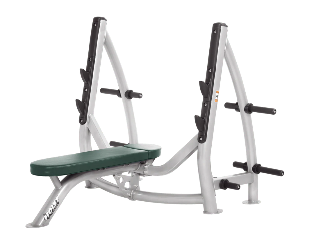 Hoist platinum hunter green commercial Olympic flat bench with built-in weight plate storage and barbell rack for strength training