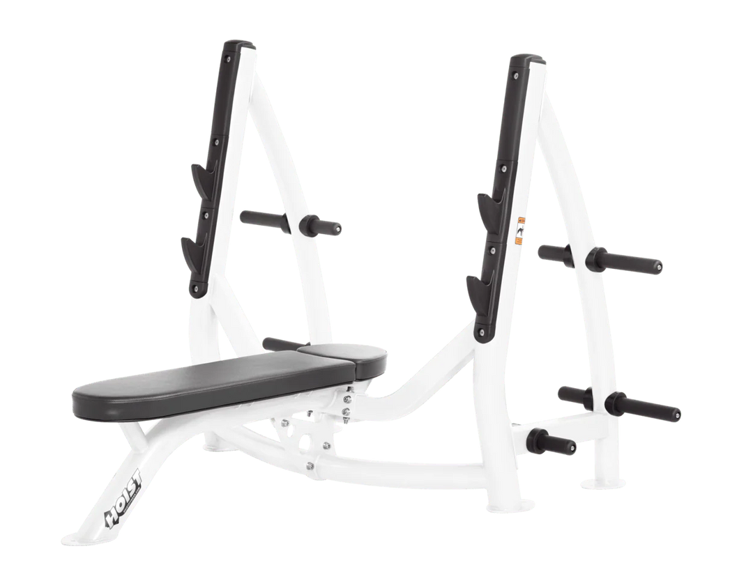 Hoist white slate grey commercial Olympic flat bench with built-in weight plate storage and barbell rack for strength training